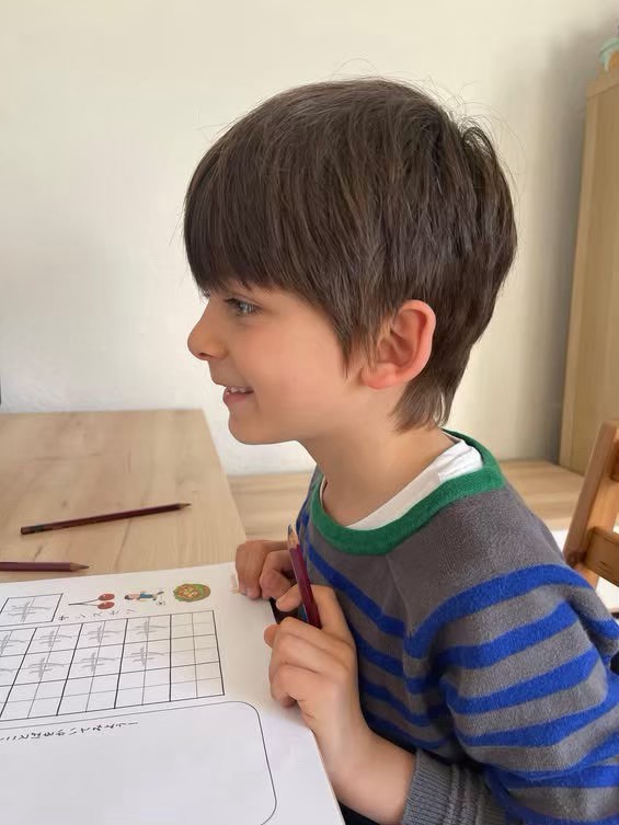 A boy working through a printout